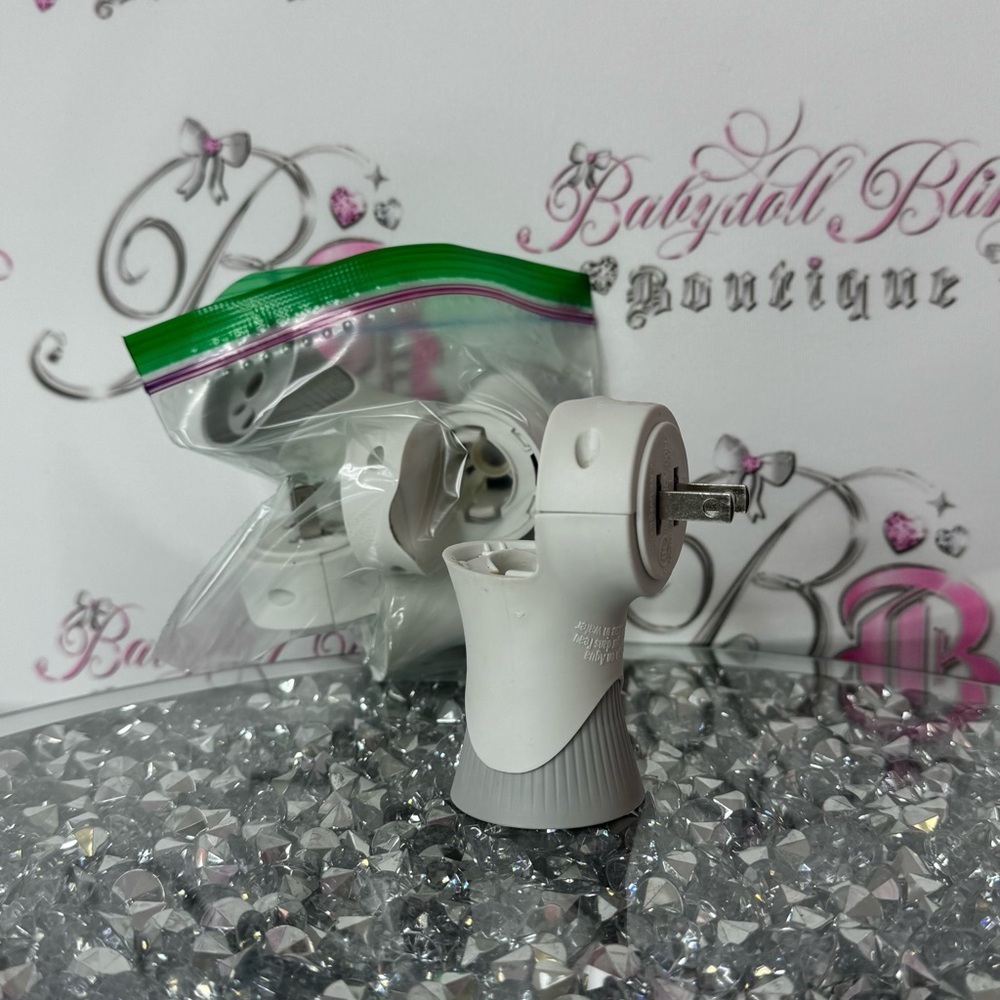 4 Airwick air freshener plug in holders wall plug in